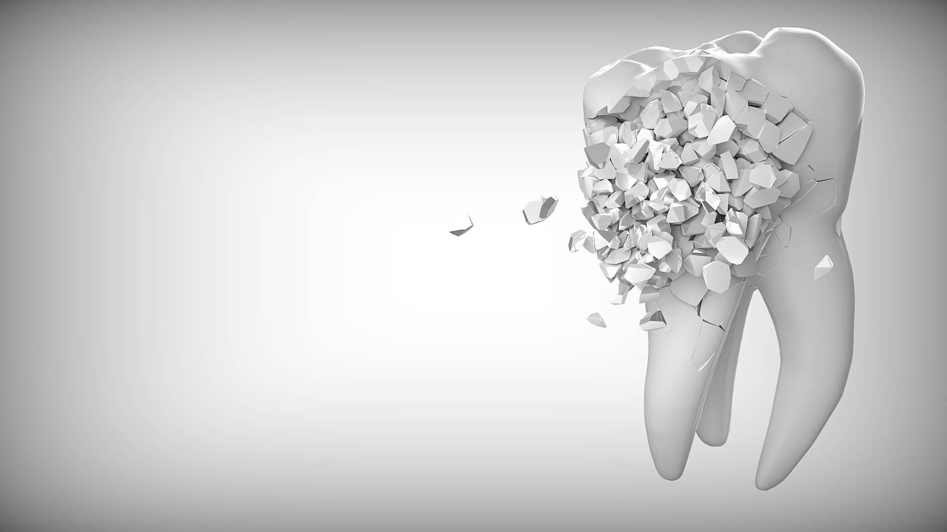 Une illustration 3D d'une dent se brisant en morceaux.